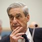 Robert Mueller&#39;s investigation team says Americans were in contact with operatives, but the indictment doesn&#39;t say any of them knew they were communicating with Russians attempting to influence the presidential election. (Associated Press/File)