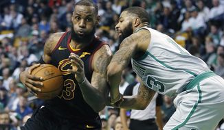 FILE - In this Feb. 11, 2018, file photo, Cleveland Cavaliers&#39; LeBron James (23) drives against Boston Celtics&#39; Marcus Morris (13) during the third quarter of an NBA basketball game in Boston. Although there were long stretches when it seemed impossible that the Cleveland Cavaliers and Boston Celtics would meet in the Eastern Conference finals, they’re set to clash for the third time in four years.(AP Photo/Michael Dwyer, File)