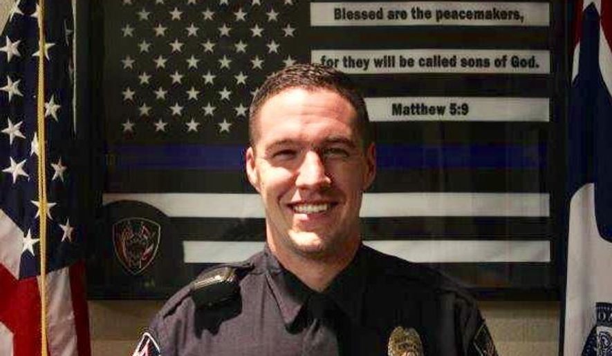 This undated photo provided by the Casper Police Department shows police officer Jacob Carlson, 27, who remains in critical condition at the Wyoming Medical Center where he was being treated for multiple gunshot wounds to his legs, chest and back. Carlson, who was wounded in a shootout on Sunday, May 6, 2018, is an Army veteran who has been with the Casper Police Department for three years. (Casper Police Department via AP)