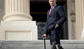 FILE - In this Nov. 15, 2016 file photo, then Rep.-elect Brian Mast, R-Fla. departs after newly-elected House members gathered for a freshman class photo on the Capitol steps, Tuesday, Nov. 15, 2016, in Washington. President Donald Trump is considering an Army veteran who is a Republican member of Congress for the position of Veterans Affairs secretary. It’s part of a lengthening White House search for a nominee following the abrupt firing of David Shulkin in March. A White House official said Rep. Brian Mast of Florida, who was elected to the House in 2016, was among the list of candidates for the job heading an agency of 360,000 employees serving 9 million veterans.  (AP Photo/Andrew Harnik)