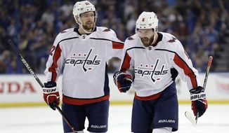 Washington Capitals defenseman Michal Kempny (6) celebrates with center Evgeny Kuznetsov (92) after Kempny scored against the Tampa Bay Lightning during the first period of Game 1 of an NHL Eastern Conference final hockey playoff series Friday, May 11, 2018, in Tampa, Fla. (AP Photo/Chris O&#39;Meara)