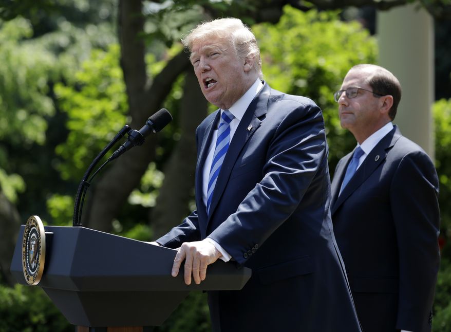 President Donald Trump speaks during an event about prescription drug prices with Health and Human Services Secretary Alex Azar, right, in the Rose Garden of the White House, Friday May 11, 2018, in Washington  (AP Photo/Evan Vucci)