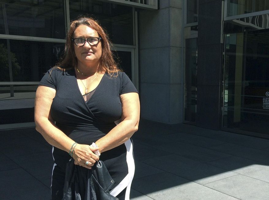 Maya Eidson, daughter of Peyton Eidson, poses outside the federal courthouse in San Francisco Friday, May 11, 2018, after her father was sentenced for drug smuggling. Peyton Eidson, a drug smuggler who prosecutors say brought thousands of pounds of marijuana into the U.S. in the 1980s before fleeing and settling in Australia was sentenced Friday to 3 years in prison. U.S. District Judge Susan Illston said her sentencing decision was "difficult," noting that Eidson was now much older and suffering from health problems. Australian officials have agreed to allow Eidson back into the country after he serves his prison term. (AP Photo/Sudhin Thanawala)