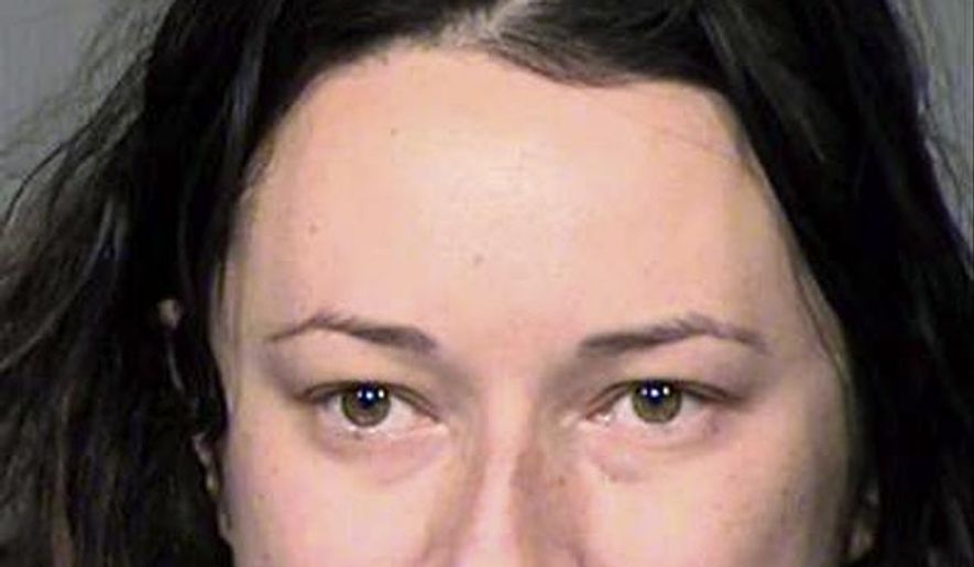 This undated booking photo provided by Maricopa County (Ariz.) Sheriff’s Office shows Jacqueline Claire Ades. Authorities say the Phoenix woman became obsessed with a man she met after only one date, sending him more than 65,000 text messages and breaking into his home. Ades remained jailed Friday, May 11, 2018, on charges of stalking, threatening and harassment by communication. (Maricopa County Sheriff’s Office via AP)