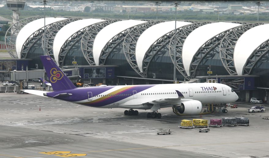 A Thai Airways jet parking at Suvarnabhumi Airport Bangkok, Thailand, Friday, May 11, 2018. The International Federation of Air Line Pilots' Association has warned that soft ground conditions at Bangkok's main international airport can cause the pavement of its taxiways to buckle or otherwise fail. (AP Photo/Sakchai Lalit)