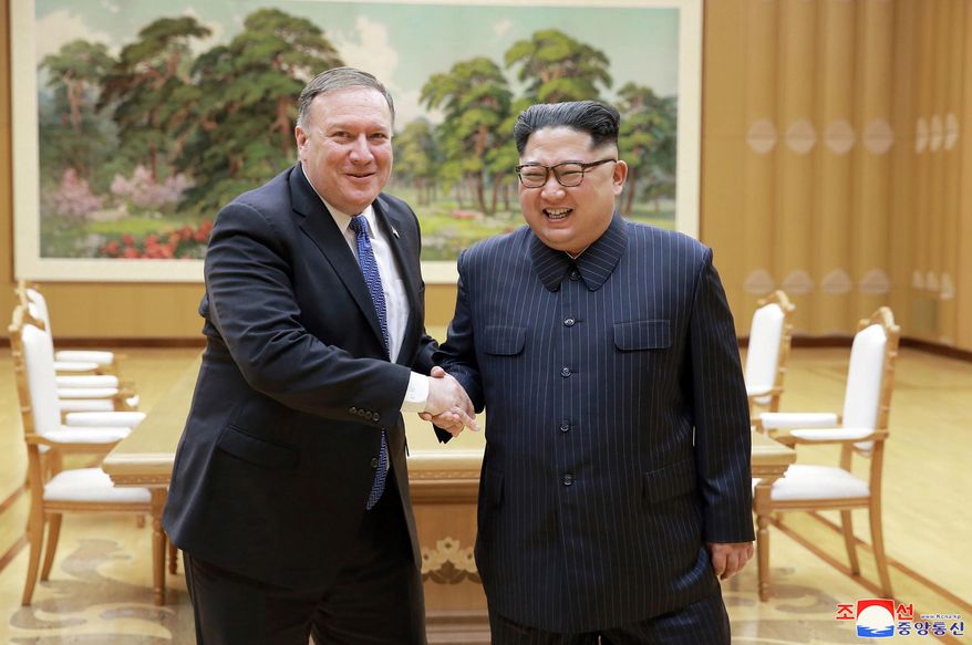 In this Wednesday, May 9, 2018, file photo provided by the North Korean government, U.S. Secretary of State Mike Pompeo, left, shakes hands with North Korean leader Kim Jong Un during a meeting at Workers' Party of Korea headquarters in Pyongyang, North Korea. Independent journalists were not given access to cover the event depicted in this image distributed by the North Korean government. The content of this image is as provided and cannot be independently verified. Korean language watermark on image as provided by source reads: "KCNA" which is the abbreviation for Korean Central News Agency. (Korean Central News Agency/Korea News Service via AP, File)