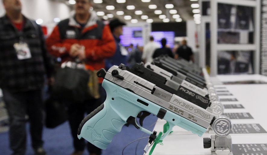 Handguns are on display at the NRA convention in Dallas, Friday, May 4, 2018. Oklahoma&#x27;s Republican Gov. Mary Fallin vetoed a bill late Friday that would have authorized adults to carry firearms without a permit or training, dealing a rare defeat to the National Rifle Association in a conservative state. (AP Photo/Sue Ogrocki)