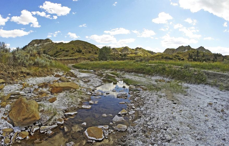 In this June 23, 2017, photo, changes in when moisture comes to Montana and in what form is part of the alterations to climate that scientists like Cathy Whitlock, from Montana State University, are seeing when looking at long-term data. (Brett French/The Billings Gazette via AP)