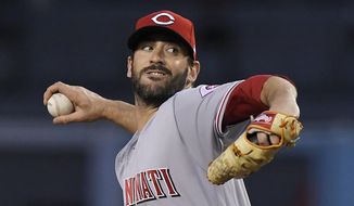 Cincinnati Reds starting pitcher Matt Harvey throws during the first inning of the team&#39;s baseball game against the Los Angeles Dodgers on Friday, May 11, 2018, in Los Angeles. (AP Photo/Mark J. Terrill)
