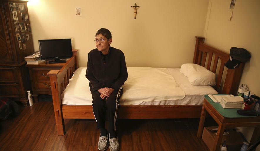 In this Wednesday, Jan. 25, 2017 file photo, Marsha Wetzel sits for a portrait in her room at Glen Saint Andrew Living Community in Niles, Ill. Wetzel moved into the senior apartment complex after her partner of 30 years died and her partner’s family evicted her from the home the couple shared. She said she was met with relentless bullying by residents mostly focused on her being a lesbian. (Chris Sweda/Chicago Tribune via AP)