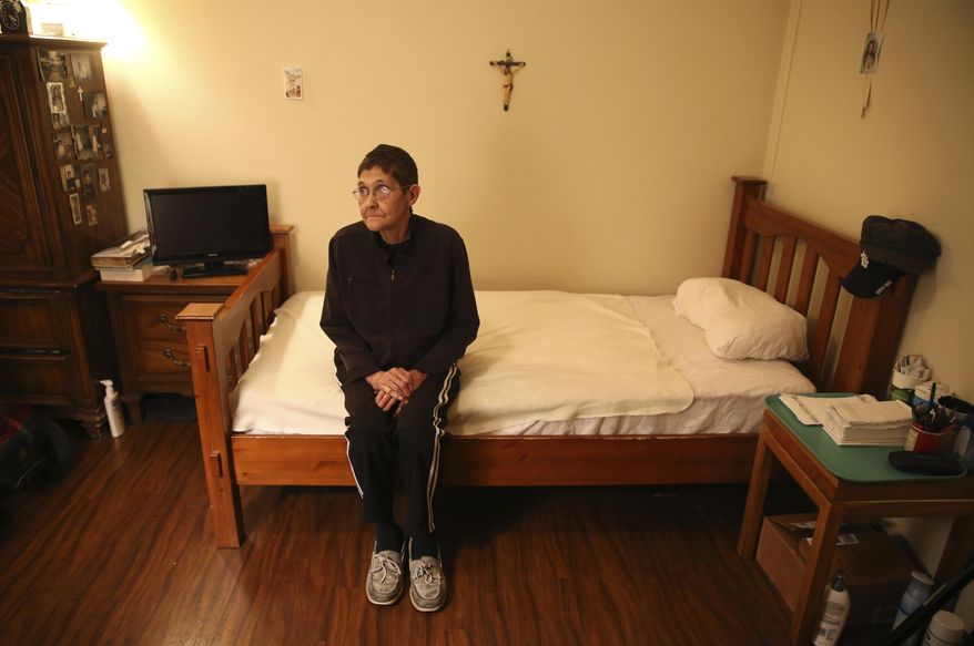 In this Wednesday, Jan. 25, 2017 file photo, Marsha Wetzel sits for a portrait in her room at Glen Saint Andrew Living Community in Niles, Ill. Wetzel moved into the senior apartment complex after her partner of 30 years died and her partner’s family evicted her from the home the couple shared. She said she was met with relentless bullying by residents mostly focused on her being a lesbian. (Chris Sweda/Chicago Tribune via AP)