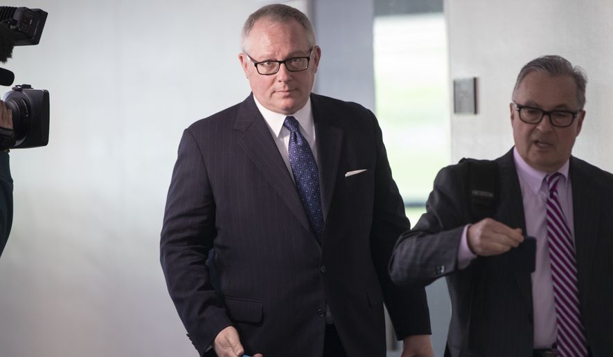 Former Donald Trump campaign official Michael Caputo, left, joined by his attorney Dennis C. Vacco, leaves after being interviewed by Senate Intelligence Committee staff investigating Russian meddling in the 2016 presidential election, on Capitol Hill in Washington, Tuesday, May 1, 2018. Caputo had previously appeared before the House Intelligence Committee as it was investigating election interference by Russia. (AP Photo/J. Scott Applewhite)