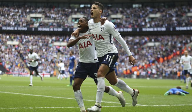 Tottenham Hotspur&#x27;s Erik Lamela, foreground, celebrates scoring his side&#x27;s forth goal of the game with teammate Danny Rose during the English Premier League soccer match between Tottenham Hotspur and Leicester City, at Wembley Stadium, in London, Sunday May 13, 2018. (Steven Paston/PA via AP)