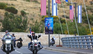 Riders from the Samson Riders, an Israeli motorcycle club, arrive on a road leading to the new U.S. Embassy during a group ride from the old embassy in Tel Aviv, ahead of the official opening, in Jerusalem, Sunday, May 13, 2018. On Monday, the United States moves its embassy in Israel from Tel Aviv to Jerusalem, the holy city at the explosive core of the Israeli-Palestinian conflict and claimed by both sides as a capital. (AP Photo/Ariel Schalit)
