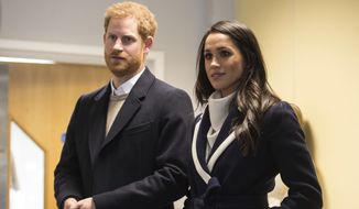 Britain&#39;s Prince Harry and his fiancee US actress Meghan Markle  watch Coach Core apprentices taking part in a training masterclass exercise during their to visit the  Nechells Wellbeing Centre in Birmingham central England on Thursday March 8, 2018 to meet Coach Core apprentices.  The Coach Core apprenticeship scheme was designed by The Royal Foundation of The Duke and Duchess of Cambridge and Prince Harry to train young people aged 16 - 24 with limited opportunities to become sports coaches and mentors within their communities.  (Oli Scarff Poool via AP)