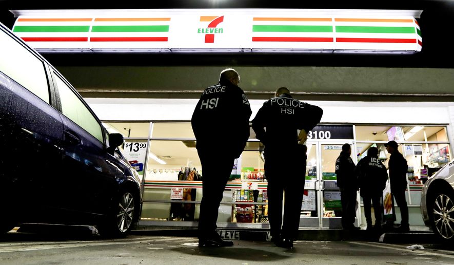 U.S. Immigration and Customs Enforcement agents serve an employment audit notice at a 7-Eleven convenience store in Los Angeles on Jan. 10, 2018. (Associated Press) **FILE**