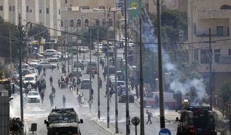 Palestinians clash with Israeli troops following a protest against the opening of the U.S. Embassy in Jerusalem, in the West Bank city of Bethlehem, Monday, May 13, 2018. (AP Photo/Majdi Mohammed)