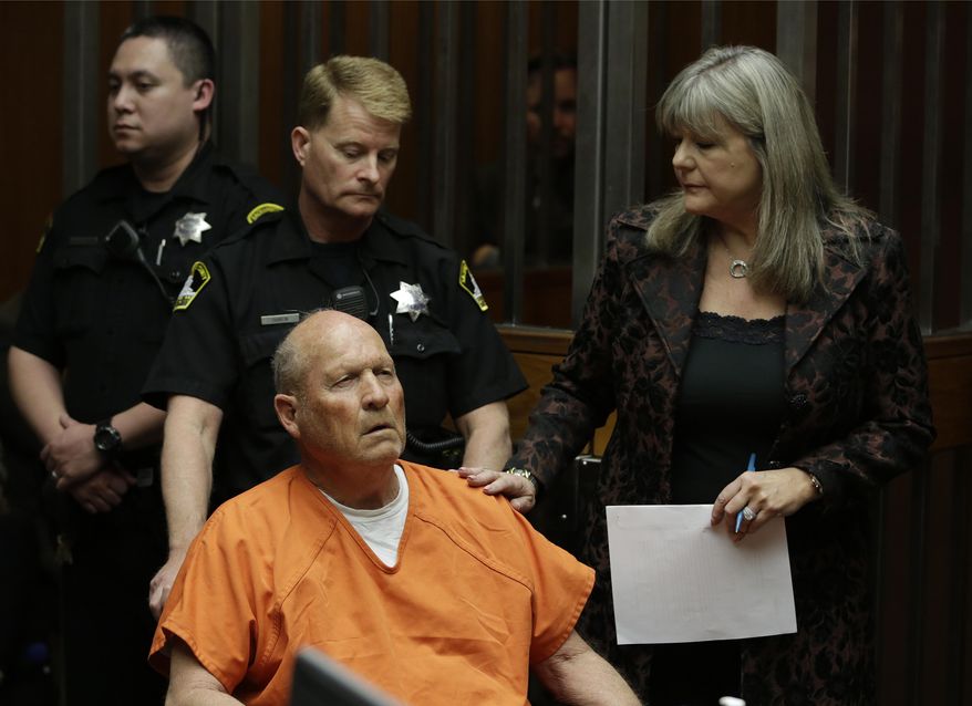 FILE - In this April 27, 2018, file photo, Joseph James DeAngelo, accompanied by Sacramento County Public Defender Diane Howard, right, makes his first appearance to face charges that include homicide and rape, in Sacramento County Superior Court in Sacramento, Calif. A judge is considering whether to make public search and arrest warrants for DeAngelo, a man who authorities call one of California's most elusive serial killers. DeAngelo is due back in court Monday, May 14, for a routine hearing. (AP Photo/Rich Pedroncelli, File)