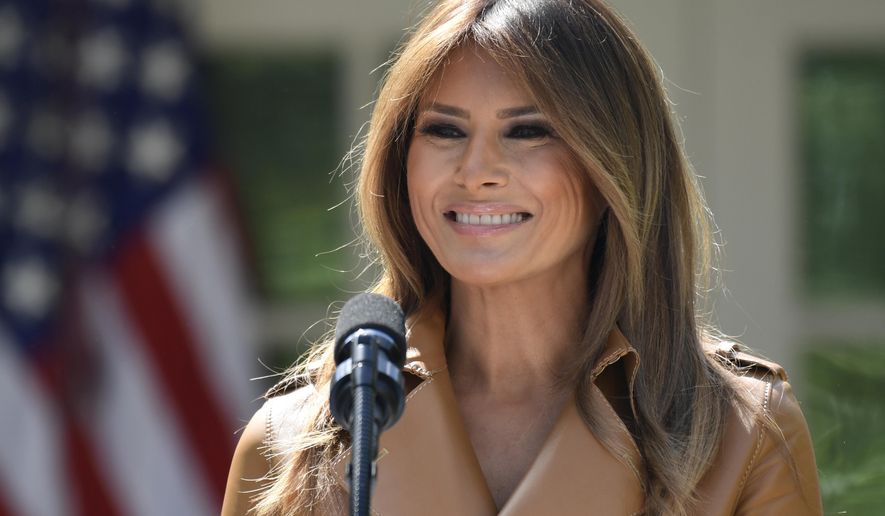 In this May 7, 2018 photo, First lady Melania Trump speaks on her initiatives during an event in the Rose Garden of the White House in Washington.  The White House says Melania Trump is hospitalized after undergoing a procedure to treat a benign kidney condition.  (AP Photo/Susan Walsh)