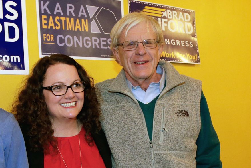 FILE - In this April 5, 2018, photo, Kara Eastman and Brad Ashford, two Democrats vying to challenge 2nd District House incumbent Don Bacon, R-Neb., pose for a photo in Omaha, Neb. Democratic and independent voters will pick one as the party's nominee in the Tuesday, May 15, primary election. (AP Photo/Nati Harnik, File)