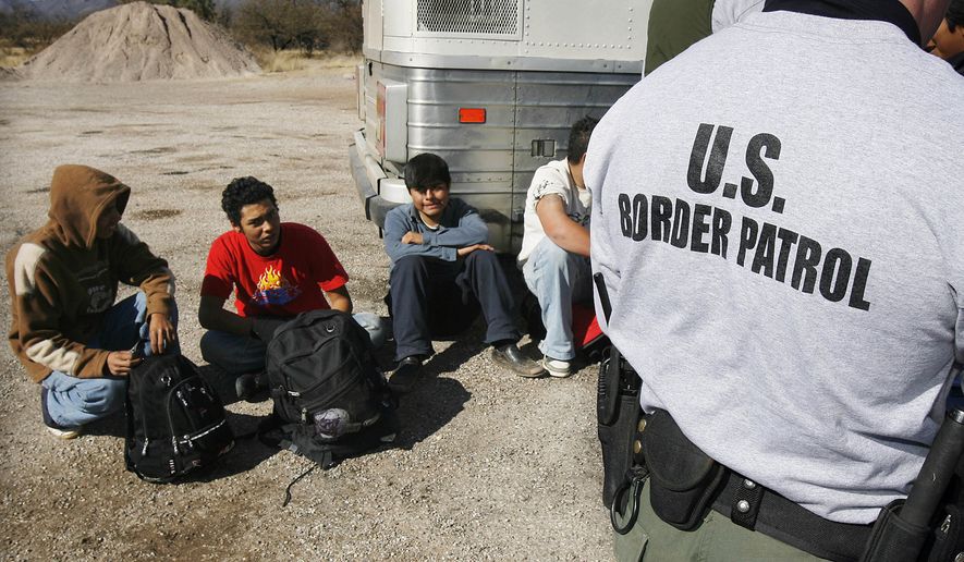 The $500 million figure split among the &quot;coyotes,&quot; or guides, who shepherd the migrants through Central America and Mexico to the border; the stash house operators and smugglers who transport them to their final destinations in the U.S.; and the major cartels that oversee all sides of the operation. (AP Photo/Ross D. Franklin, File)