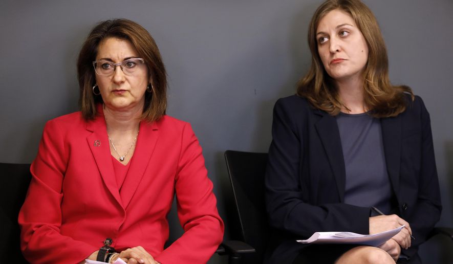 Planned Parenthood of the Heartland President and CEO Suzanna de Baca, left, and ACLU of Iowa Legal Director Rita Bettis look on during a news conference, Tuesday, May 15, 2018, in Des Moines, Iowa. Planned Parenthood and the American Civil Liberties Union said Tuesday that they had filed a lawsuit challenging the nation's most restrictive abortion law, an Iowa provision that bans most abortions once a fetal heartbeat is detected, around the sixth week of pregnancy. (AP Photo/Charlie Neibergall)