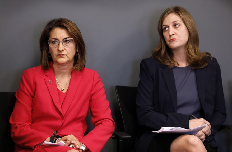 Planned Parenthood of the Heartland President and CEO Suzanna de Baca, left, and ACLU of Iowa Legal Director Rita Bettis look on during a news conference, Tuesday, May 15, 2018, in Des Moines, Iowa. Planned Parenthood and the American Civil Liberties Union said Tuesday that they had filed a lawsuit challenging the nation's most restrictive abortion law, an Iowa provision that bans most abortions once a fetal heartbeat is detected, around the sixth week of pregnancy. (AP Photo/Charlie Neibergall)