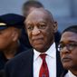 In this April 26, 2018 file photo, Bill Cosby, center, leaves the the Montgomery County Courthouse in Norristown, Pa. Cosby will be sentenced on Sept. 24, five months after he was convicted of sexual assault. (AP Photo/Matt Slocum, File)