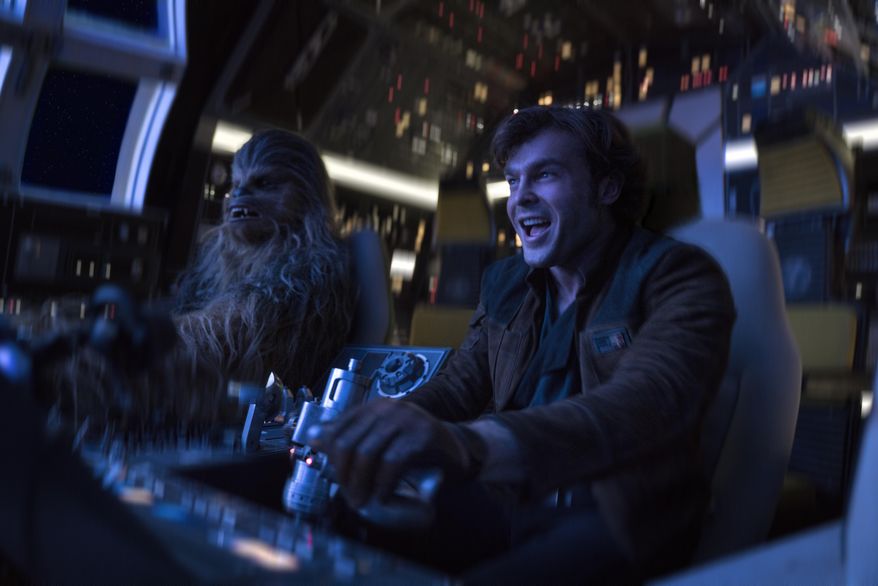 In this image released by Lucasfilm, Alden Ehrenreich, right, and Joonas Suotamo appear in a scene from "Solo: A Star Wars Story." (Jonathan Olley/Lucasfilm via AP)