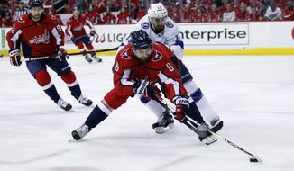 Washington Capitals defenseman Michal Kempny (6), from the Czech Republic, skates with the puck with Tampa Bay Lightning center Cedric Paquette (13) behind him during the first period of Game 3 of the NHL Eastern Conference finals hockey playoff series, Tuesday, May 15, 2018, in Washington. (AP Photo/Alex Brandon) ** FILE **