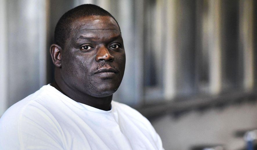 FILE - In this Sept. 2016 file photo, prisoner David Robinson poses for a portrait in the visiting area inside Jefferson City Correctional Center in Jefferson City, Mo. Missouri Attorney General Josh Hawley is recommending that charges be dismissed against Roberson, who has served nearly 20 years in prison for the death of a southeast Missouri woman. Hawley announced Monday, May, 14, 2018, that his office is recommending Robinson, be released from prison. Robinson has been in prison since 2001 for the killing of Sheila Box, who was shot to death after leaving a Sikeston bar. (Laura Simon/The Southeast Missourian via AP File)