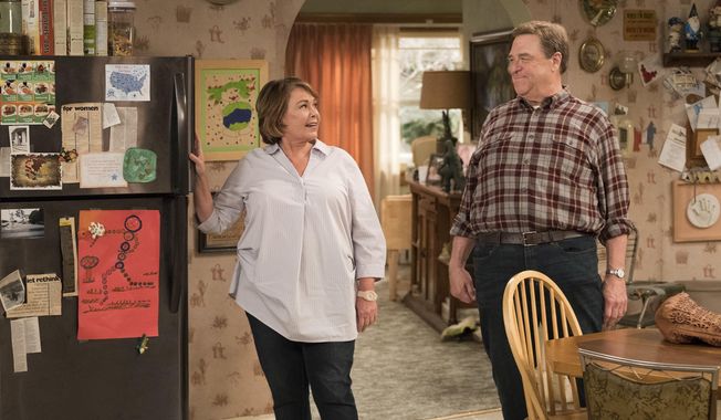 This image released by ABC shows Roseanne Barr, left, and John Goodman in a scene from the comedy series &amp;quot;Roseanne.&amp;quot; Expect &amp;quot;Roseanne&amp;quot; to cool it on politics and concentrate on family stories when it returns for the second season of its revival next year. ABC Entertainment chief Channing Dungey noted that as the first season went on, the focus shifted from politics to family. She said that direction will continue next season. (Adam Rose/ABC via AP)