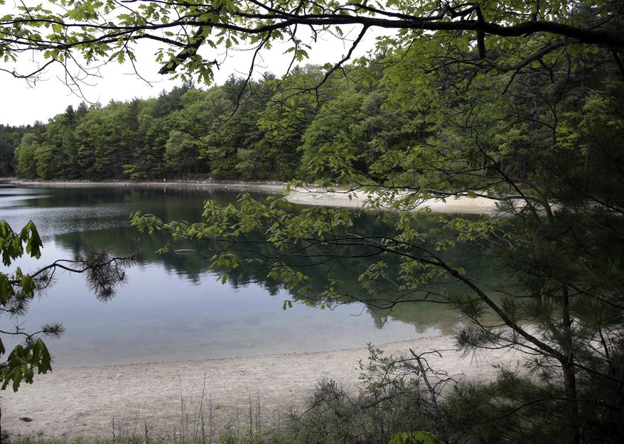 A view of Walden Pond in Concord, Mass., where the 19th century American philosopher and naturalist Henry David Thoreau spent two years in solitude and reflection. A new Playstation game devoted to the Thoreau classic debuts on Tuesday, May 15, 2018. (AP Photo/Elise Amendola, File)