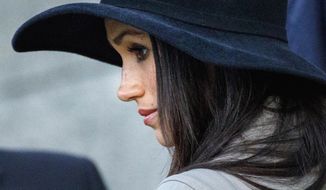 Meghan Markle attends an Anzac Day dawn service with Britain&#39;s Prince Harry, at Hyde Park Corner in London, Wednesday, April 25, 2018. ANZAC Day commemorates the moment when Australian and New Zealand Army Corps troops waded ashore at the Gallipoli peninsula in Turkey 103 years ago in their first major battle of World War I. (Tolga Akmen/Pool Photo via AP)