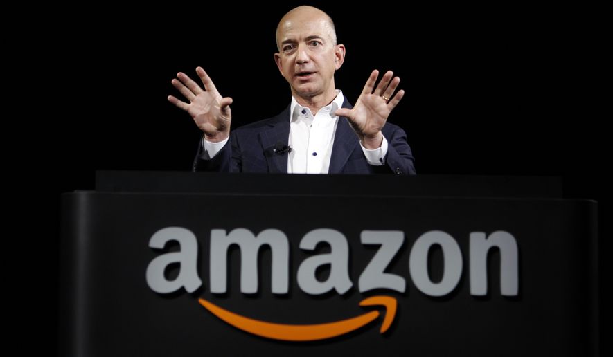 Jeff Bezos, CEO and founder of Amazon, at the introduction of the new Amazon Kindle Fire HD and Kindle Paperwhite personal devices, in Santa Monica, Calif., Thursday, Sept. 6, 2012. (AP Photo/Reed Saxon)