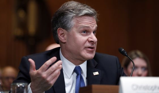 FBI Director Christopher Wray testifies during a hearing of the Senate Subcommittee on Commerce, Justice, Science, and Related Agencies about the FY2019 budget, on Capitol Hill, Wednesday, May 16, 2018 in Washington. (AP Photo/Alex Brandon)