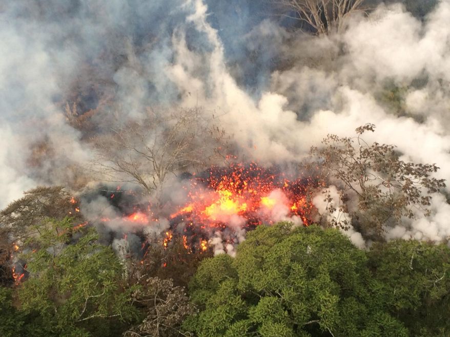 This Wednesday, May 16, 2018, image provided by the U.S. Geological Survey shows lava spattering from an area between active Fissures 16 and 20 photographed at 8:20 a.m. HST, on the lower east rift of the Kilauea volcano, near Pahoa, Hawaii. Plumes range from 1 to 2 kilometers (3,000 to 6,000 feet) above the ground. Officials say some vents formed by Kilauea volcano are releasing such high levels of sulfur dioxide that the gas poses an immediate danger to anyone nearby. (U.S. Geological Survey via AP)