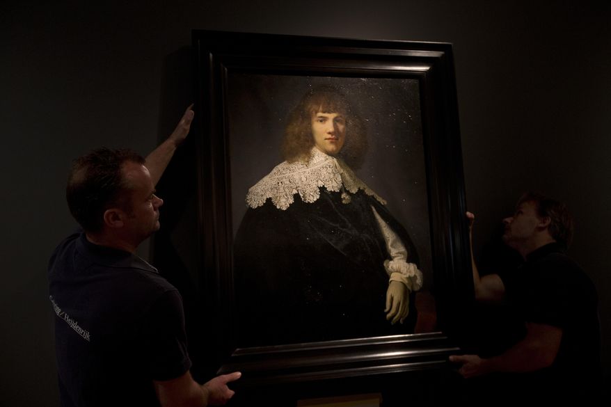 A painting attributed to famous Dutch Master Rembrandt is put on display at the Hermitage museum in Amsterdam, Netherlands, Wednesday, May 16, 2018. The unsigned painting which will be sold by gallery owner Jan Six, after being exhibit for a month at the Hermitage Amsterdam. (AP Photo/Peter Dejong)
