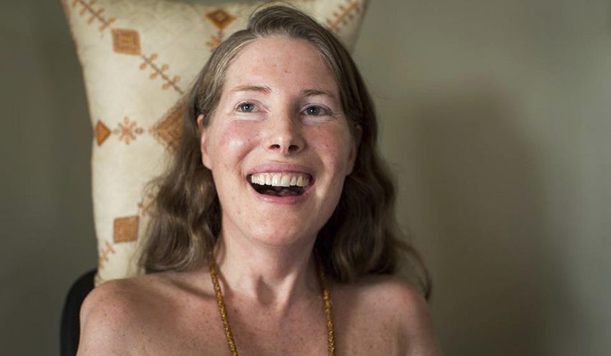 FILE - In this Sunday, July 24, 2016, file photo provided by Niels Alpert, Betsy Davis smiles during her "Right To Die Party" in Ojai, Calif. Davis threw herself the party as she became one of the first to use a California law to take her own life in 2016. Advocates say the terminally ill may die tougher deaths after a judge on Tuesday, May 15, 2018, threw out the law that allows adults to obtain a prescription for life-ending drugs. (Niels Alpert via AP, File)