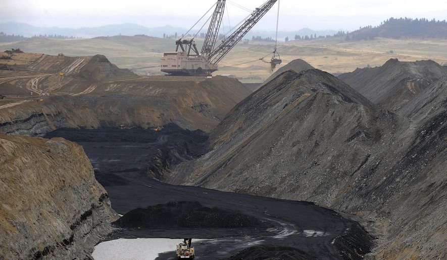 In this May 9, 2008, photo, a dragline crane operates at Westmoreland Coal Company's Absaloka mine northeast of Hardin, Montana on the Crow Indian Reservation. The Montana-based Western Organization of Resource Councils said Wednesday, May 16, 2018, that it's concerned a bankruptcy by Westmoreland could leave taxpayers to cover future reclamation costs. (AP Photo/Billings Gazette, David Grubbs)