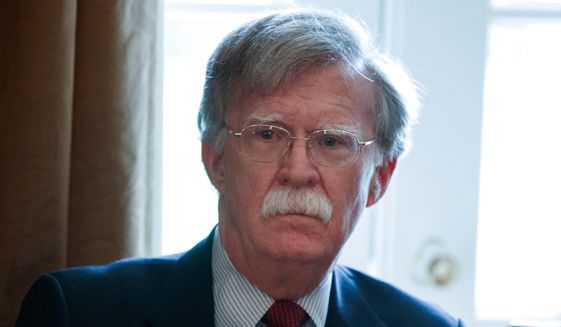 In this April 9, 2018, file photo, National Security Adviser John Bolton listens as President Donald Trump speaks during a Cabinet meeting at the White House in Washington. (AP Photo/Evan Vucci, File)