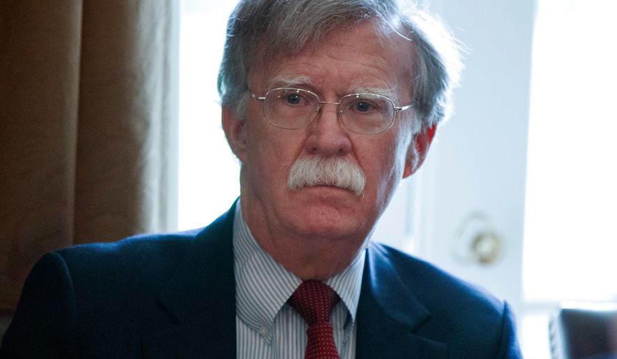 FILE - In this April 9, 2018, file photo, National Security Adviser John Bolton listens as President Donald Trump speaks during a cabinet meeting at the White House in Washington. After announcing early Wednesday that it was pulling out of high-level talks with Seoul because of a new round of U.S.-South Korea military exercises, the North took aim at Bolton and said it might have to reconsider whether to proceed with the summit between Trump and North Korean leader Kim Jong Un because it doubts how seriously Washington actually wants peaceful dialogue. (AP Photo/Evan Vucci, File)