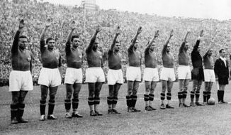 FILE - In this June 19, 1938 file photo, the Italian soccer team perform the fascist salute in Colombes Stadium, Paris, before the start of the World Cup soccer final match against Hungary. Earlier in the tournament that was taking place amid the drumbeat of war, the team caused consternation by wearing black shirts in a match. The 21st World Cup begins on Thursday, June 14, 2018, when host Russia takes on Saudi Arabia. (AP Photo/File)