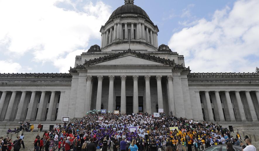 Hundreds of charter school students, teachers, and supporters rally at the Capitol in Olympia, Wash., Thursday, May 17, 2018. Teachers unions and other groups have sued over Washington state's 2016 charter school law, which was enacted after the justices struck down the old law as unconstitutional. (AP Photo/Ted S. Warren)