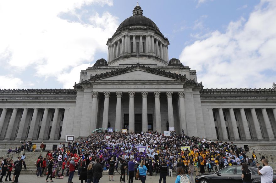 Hundreds of charter school students, teachers, and supporters rally at the Capitol in Olympia, Wash., Thursday, May 17, 2018. Teachers unions and other groups have sued over Washington state's 2016 charter school law, which was enacted after the justices struck down the old law as unconstitutional. (AP Photo/Ted S. Warren)