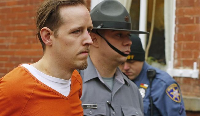 FILE – In this Oct. 31, 2014, file photo, Eric Frein, left, is escorted out by police after his arraignment at the Pike County Courthouse in Milford, Pa. Lawyers for Frein, on death row for fatally shooting Pennsylvania State Police Cpl. Bryon Dickson II and wounding Trooper Alex Douglass in Sept. 2014, were scheduled to argue before the state Supreme Court on Thursday, May 17, 2018, that the justices should throw out Frein&#x27;s conviction. (AP Photo/Rich Schultz, File)