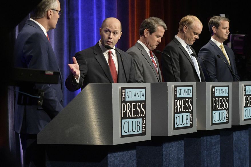 Georgia Republican gubernatorial candidates Casey Cagle, from left to right, listens to a rebuttal from Hunter Hill, as Brian Kemp, Clay Tippins, and Michael Williams look on during a debate, Thursday, May 17, 2018, in Atlanta. (AP Photo/John Amis)