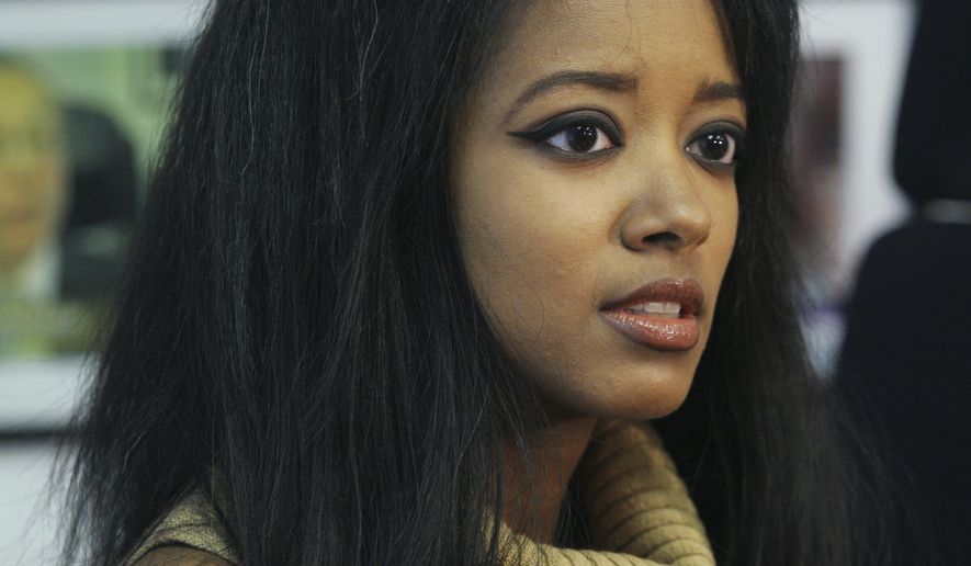 FILE - In this Sept. 22, 2006, file photo, former Playboy playmate Stephanie Adams speaks at an interview in New York about her lawsuit against the New York City Police Department. Law enforcement officials say Adams, who was involved in a custody battle, apparently jumped with her 7-year-old son Vincent from the penthouse at the Gotham Hotel in midtown Manhattan. They were found on a second-floor balcony by workers at about 8:15 a.m. Friday, May 18, 2018. (AP Photo/Tina Fineberg, File)