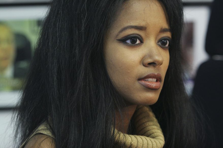 FILE - In this Sept. 22, 2006, file photo, former Playboy playmate Stephanie Adams speaks at an interview in New York about her lawsuit against the New York City Police Department. Law enforcement officials say Adams, who was involved in a custody battle, apparently jumped with her 7-year-old son Vincent from the penthouse at the Gotham Hotel in midtown Manhattan. They were found on a second-floor balcony by workers at about 8:15 a.m. Friday, May 18, 2018. (AP Photo/Tina Fineberg, File)