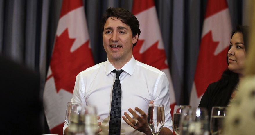 Prime Minister Justin Trudeau gestures during a roundtable discussion with members of the Canadian Technology Accelerator in Cambridge, Mass., Thursday, May 17, 2018. (AP Photo/Charles Krupa)
